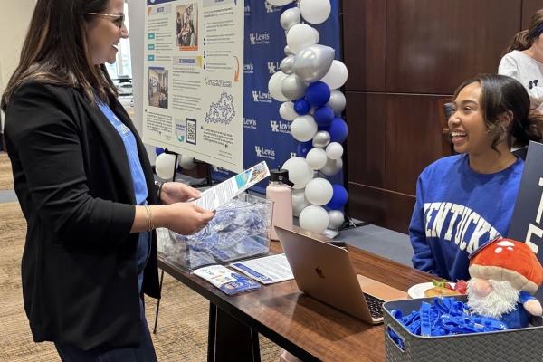 TEK student ambassaor, Karmen Parker, shares TEK's course offerings with an Honor's college advisor