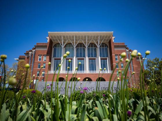 W.T. Young Library with flowers in the foreground